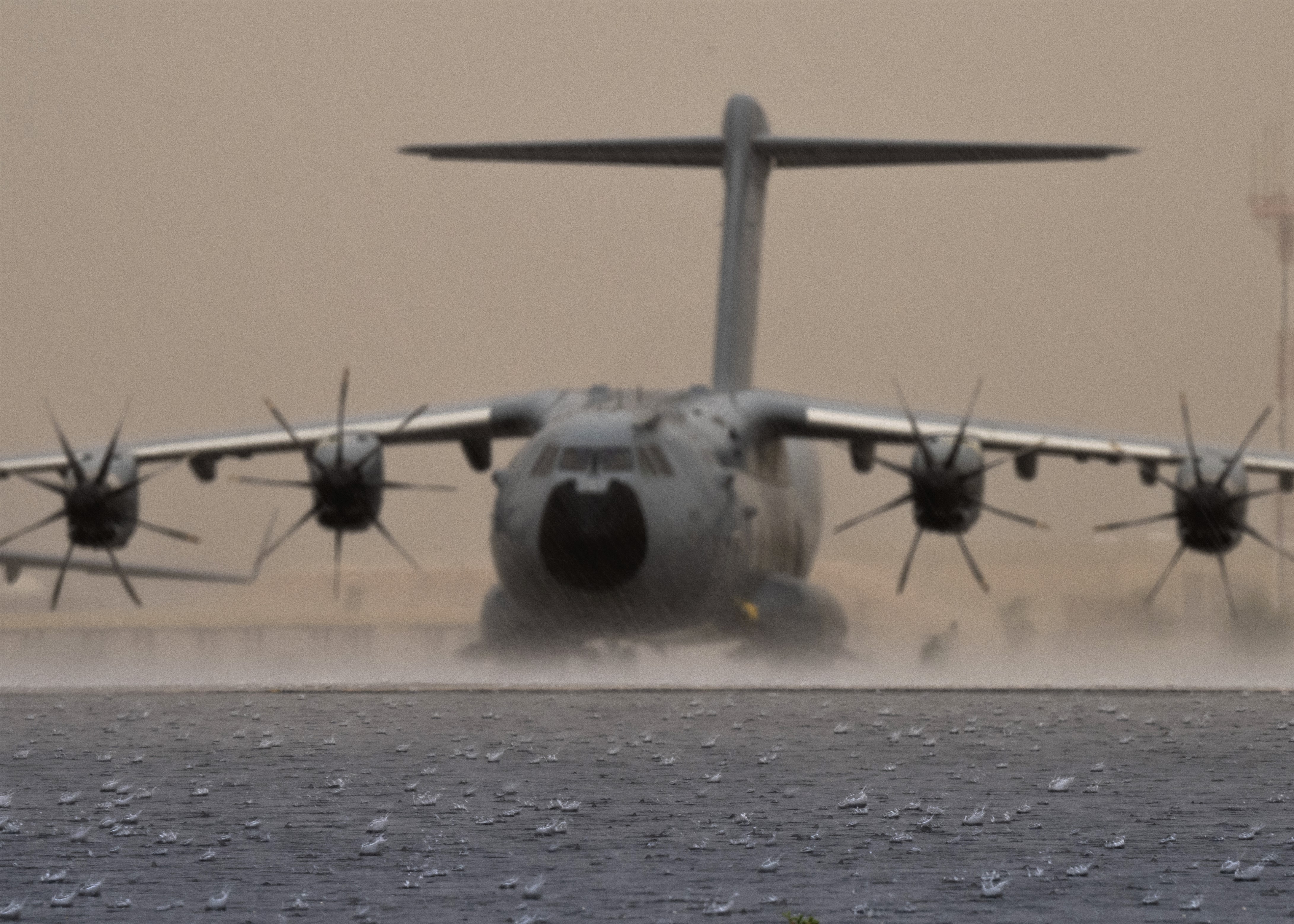 Photo - RAF A400M waiting to depart in a Desert thunderstorm - credit-Alexander Cook , TSgt, USAF